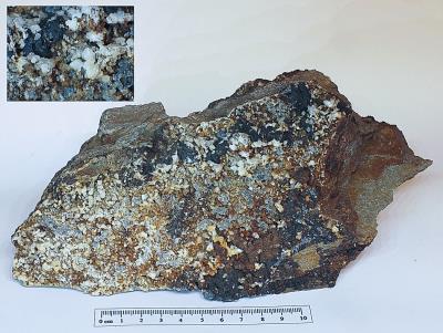 Mineral assemblage on host rock, Aberdaunant. (CWO) Bill Bagley Rocks and Minerals